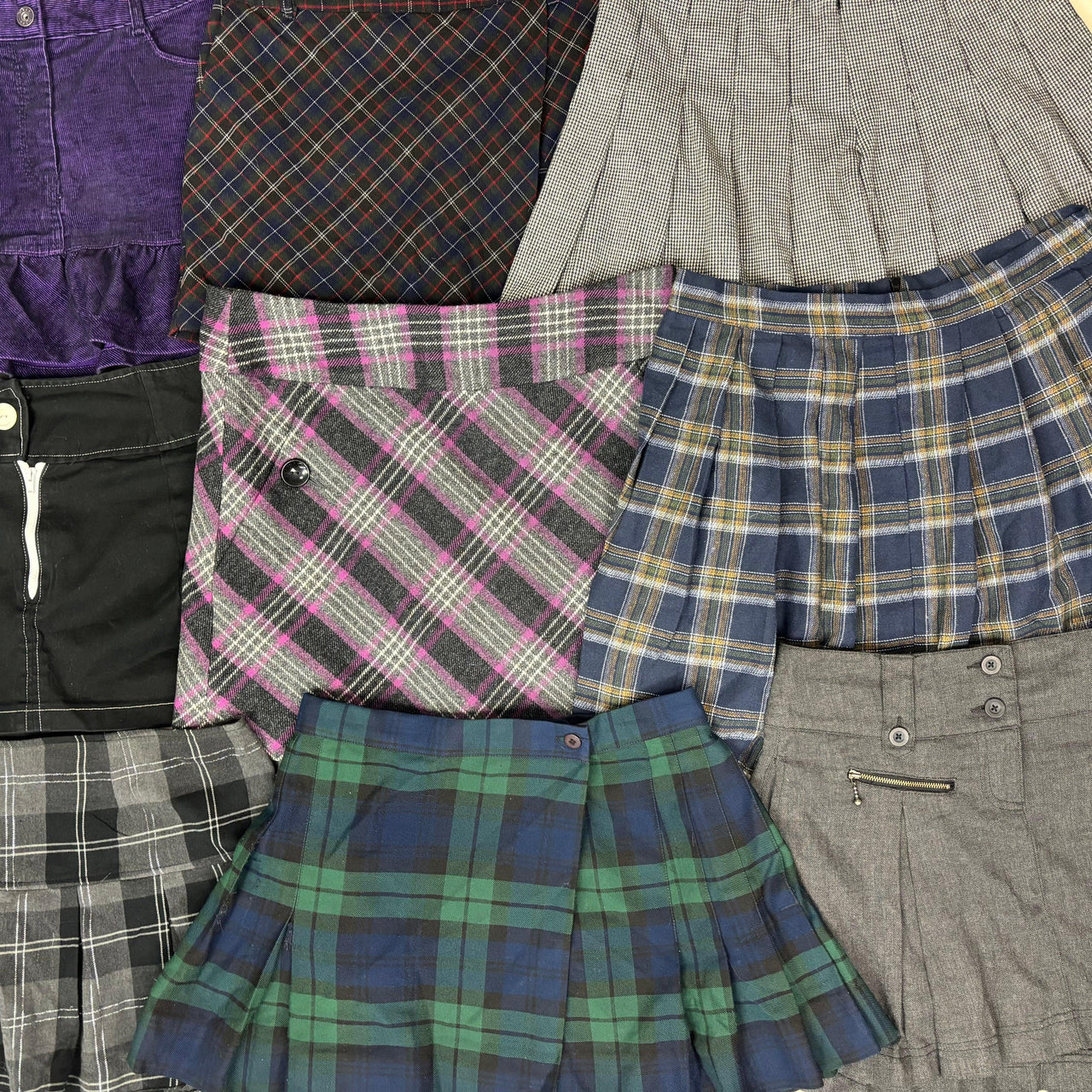 Assorted autumn winter mini skirts in various plaid patterns and colors including purple, gray, pink, blue, green, and black .