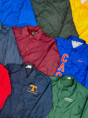 Assorted coach jackets in blue, burgundy, green, and navy, with snap fronts and collegiate logos.